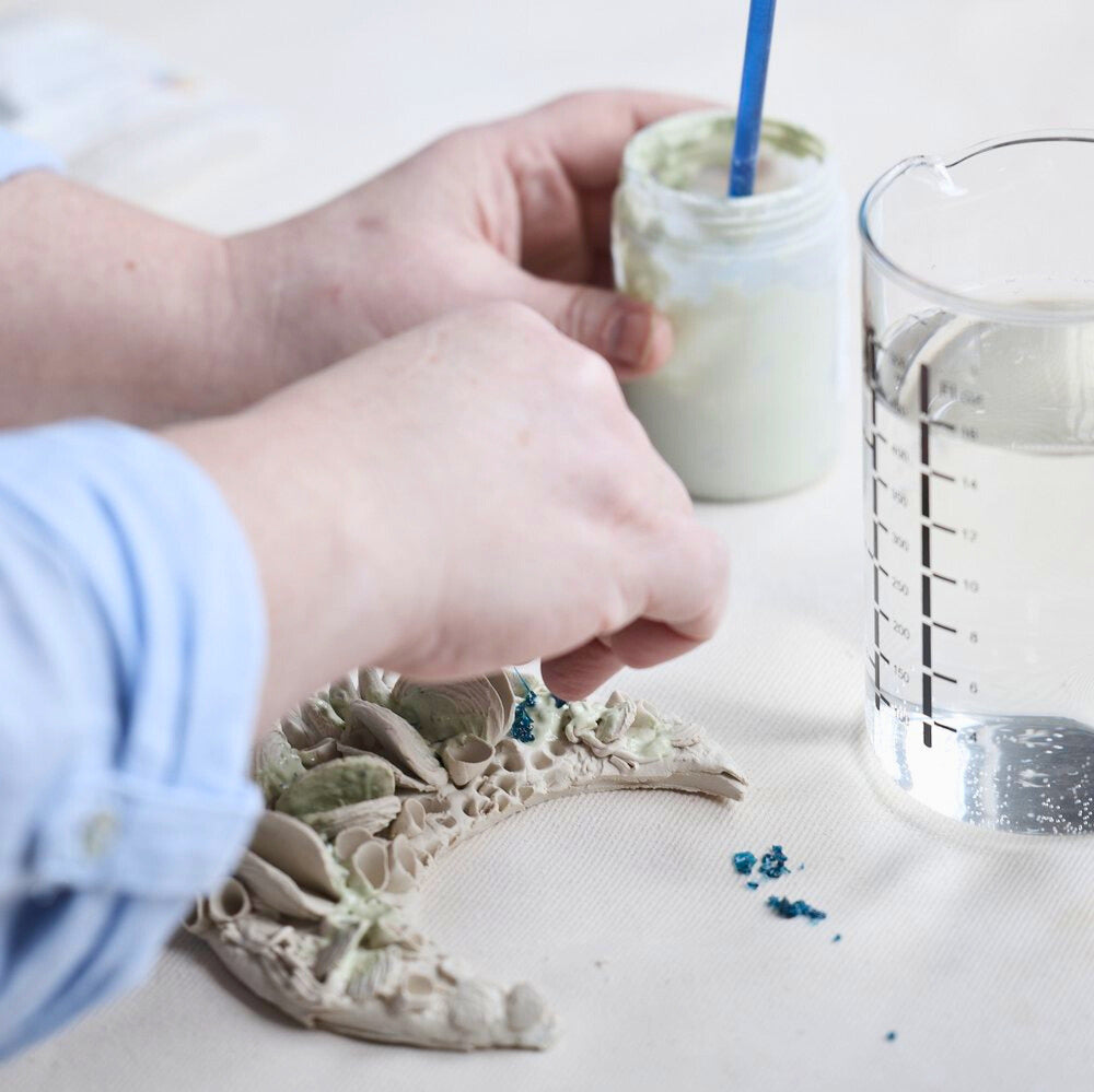 Sharlene Temple pictured working on a ceramic piece of art.